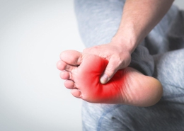 What is the symptom of foot pain?
